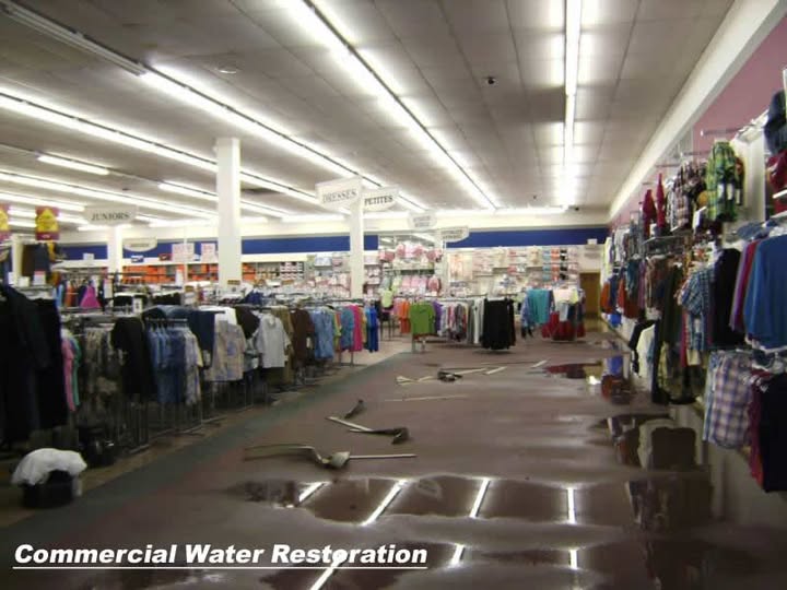 Water across a retail sales floor during a commercial water damage restoration job
